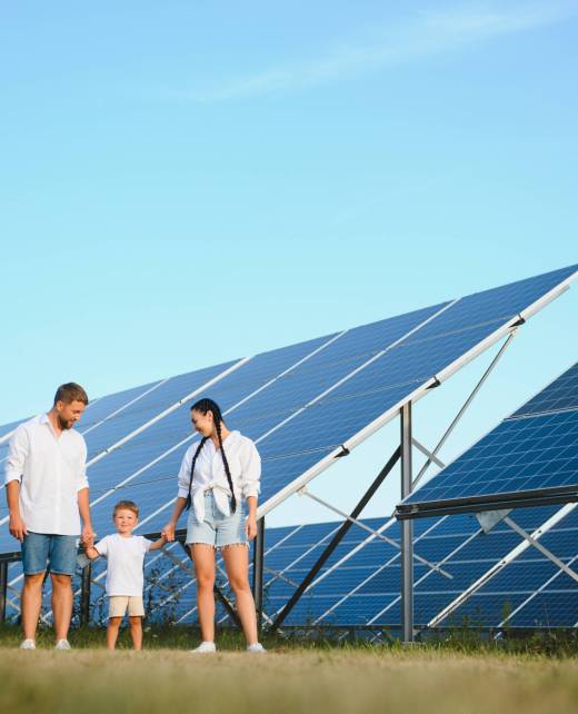 Happy young family near solar panels. Solar energy